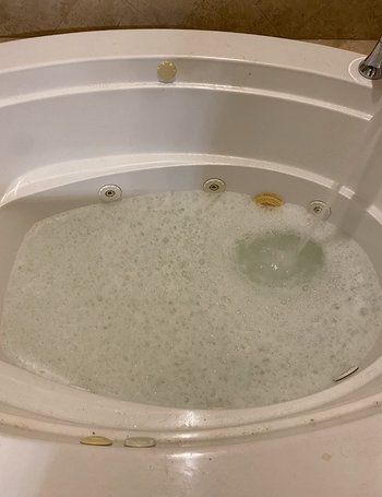 The same jetted tub now spotless and free of dirt after using the cleaner