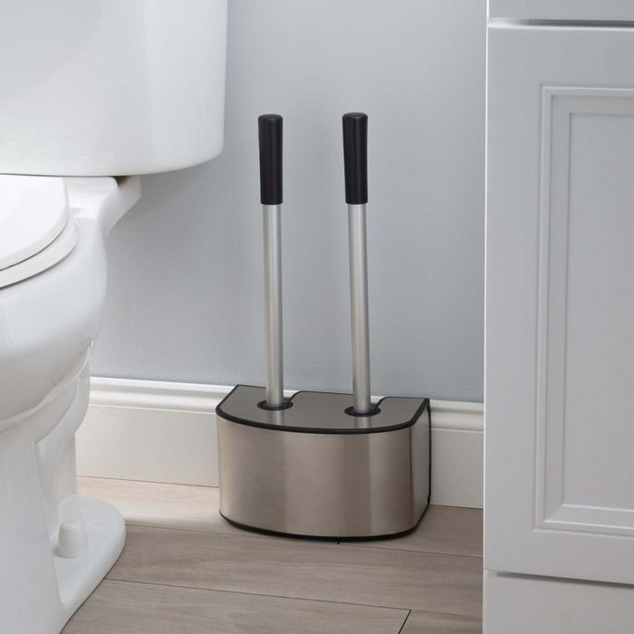 A silver-tone plunger and toilet brush set