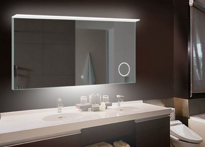 A generously sized illuminated bathroom mirror