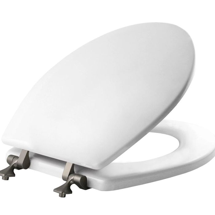 An all-white toilet seat with sleek grey hinges