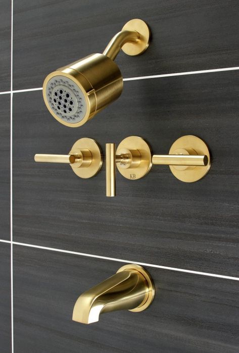 The shower head, faucet, and knob set in a gold-tone finish