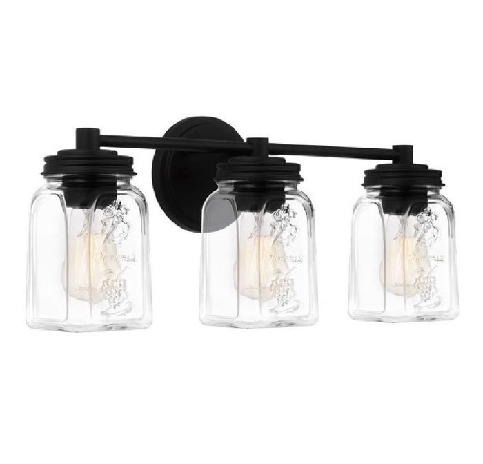 A trio of overhead lights with sleek black mounts