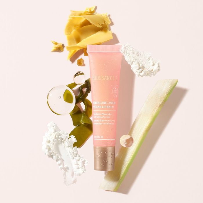 The pink tube of lip balm next to the ingredients list.