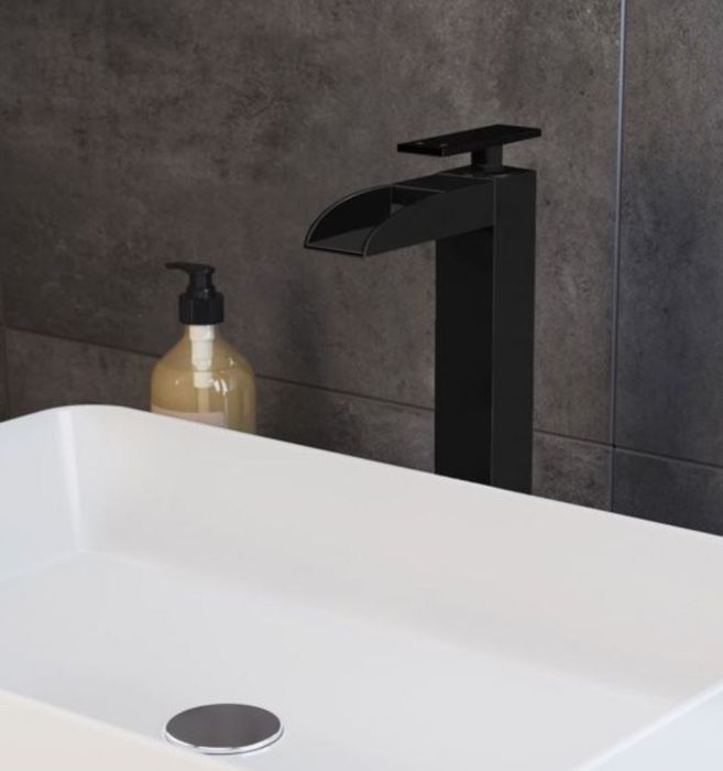 A matte-black waterfall faucet paired with a sleek sink