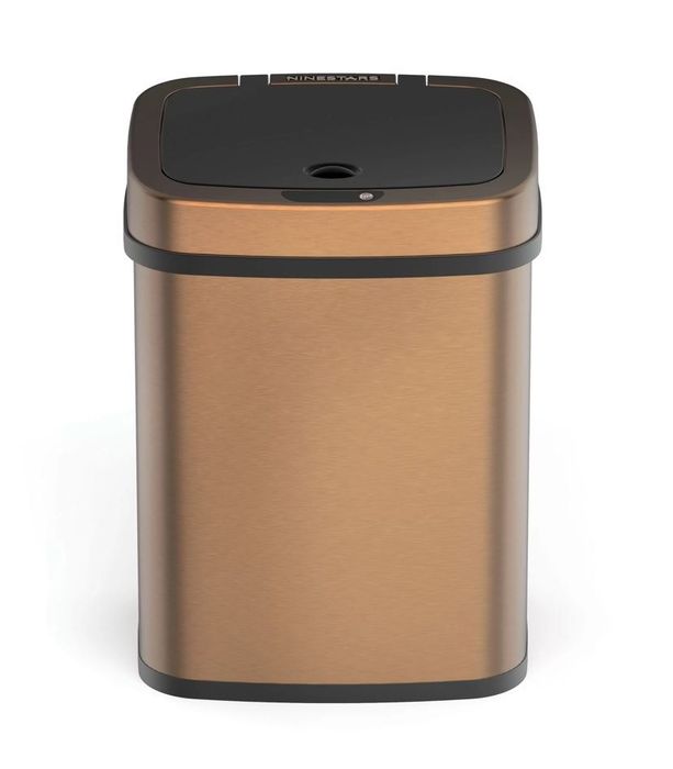 A sleek copper waste basket with a modern touch