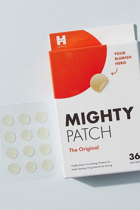 A pack of 36 round Mighty Patches, each attached to a plastic adhesive strip for easy application.