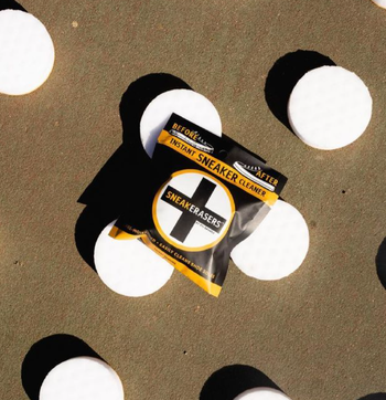 A set of round, white sneaker erasers.
