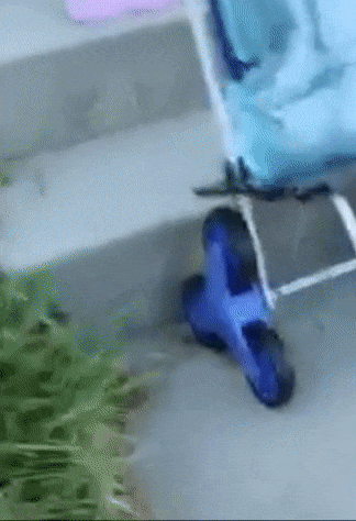 A model demonstrating how the trolley can be used to carry a water jug up the front steps.