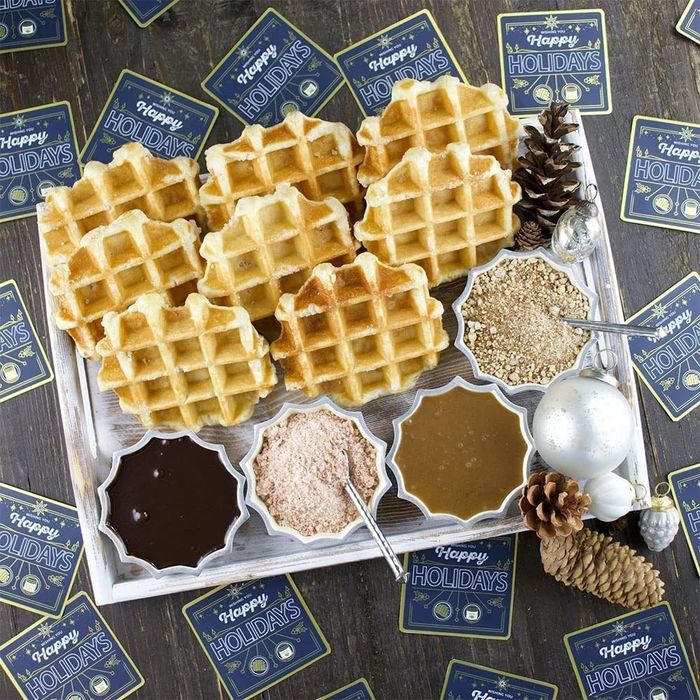The waffles and toppings from the gift box, beautifully arranged on a holiday tray.