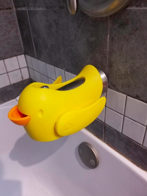 A duck-shaped cover for the bath spout.