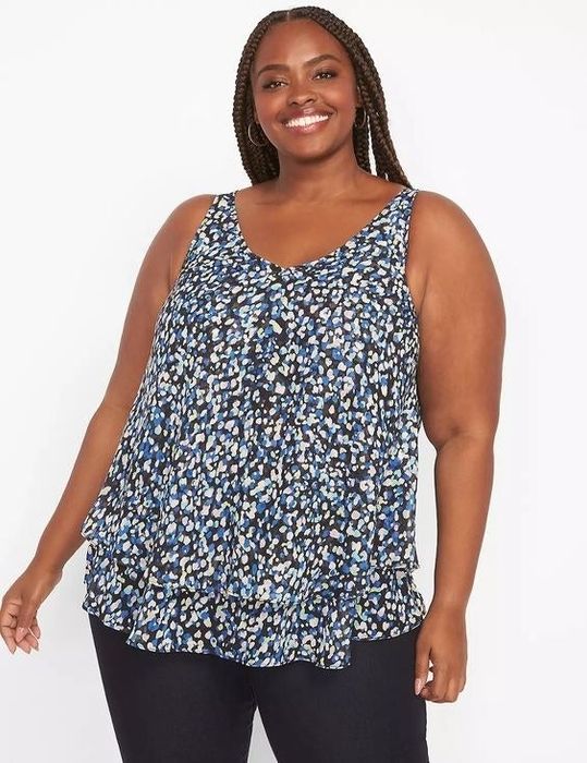 Another model showcasing a blue floral tank