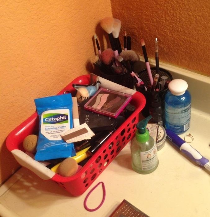 A variety of beauty products scattered across the counter.