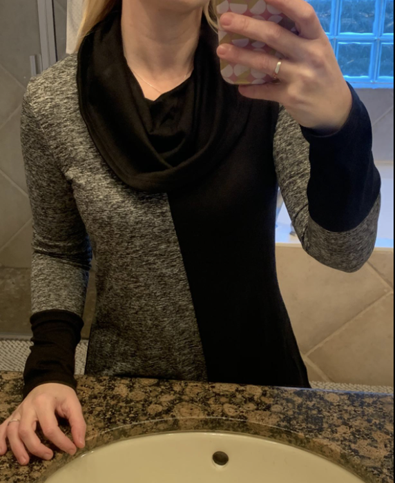 close-up photo of the reviewer wearing the sweater