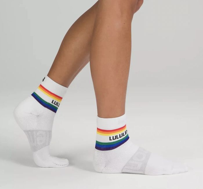 Someone wearing the white rainbow-striped socks.