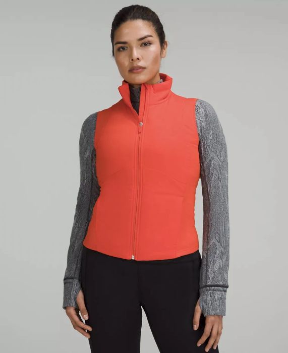 Model sporting the bright orange vest.