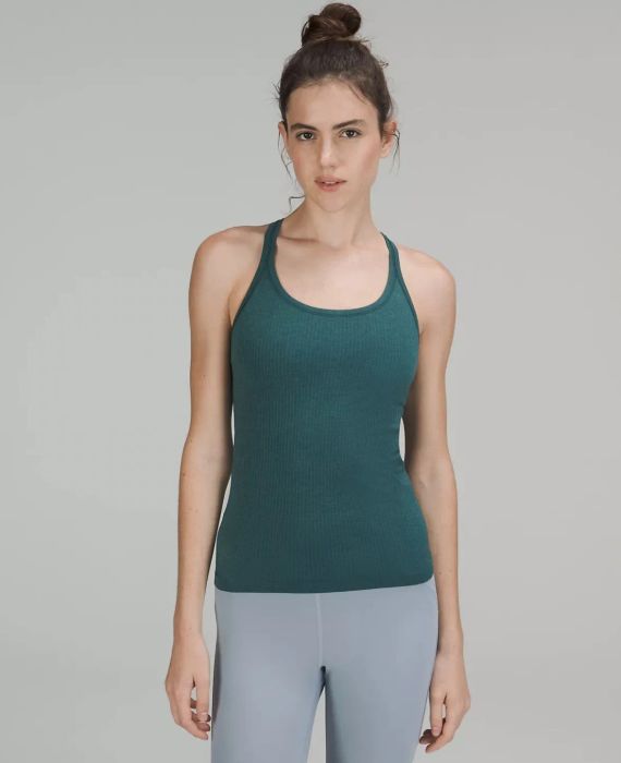 Model wearing the teal tank top.
