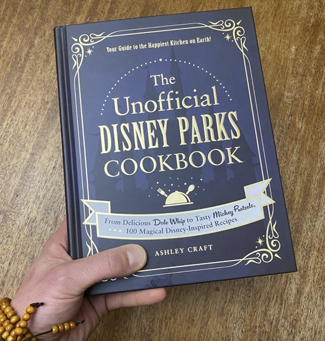 a reviewer holding up the cookbook