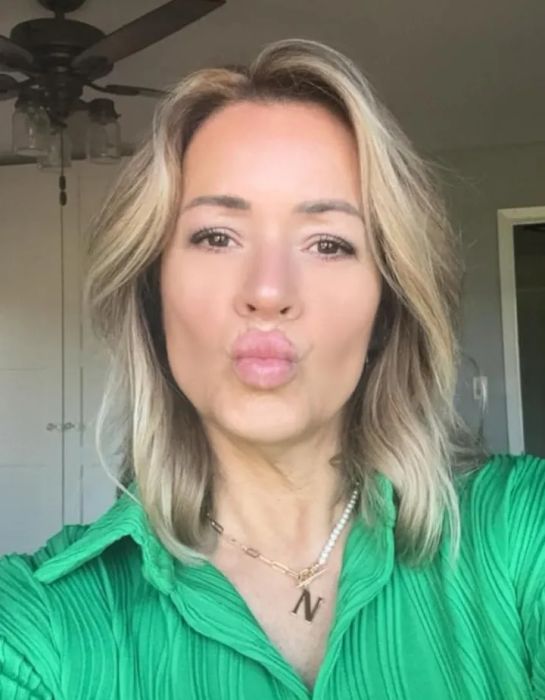 A reviewer taking a selfie, proudly showing off their hair after using the product.