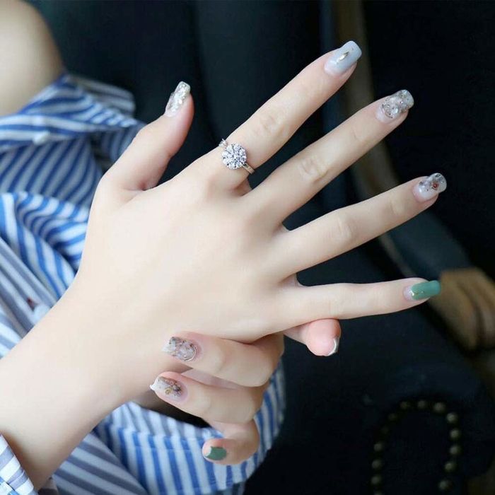 the large, gemstone-studded ring