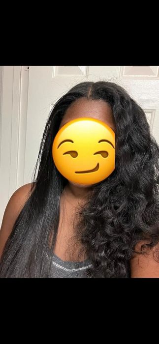 A person with one side of their hair straight and the other side curly, showcasing a hair transformation for a shopping article. Their face is hidden behind a smiley emoji.