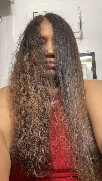 A person with long hair demonstrates a transformation, showing curly hair on the left and straight hair on the right while wearing a sleeveless top.