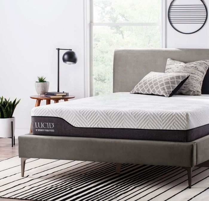 The Lucid mattress placed on a sleek gray bed frame, showcasing its stylish design and comfort.