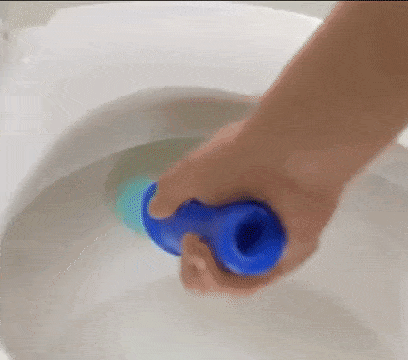Gif showing a hand stamping the gel into a toilet, followed by a flush, with arrows indicating how the gel cleans the bowl