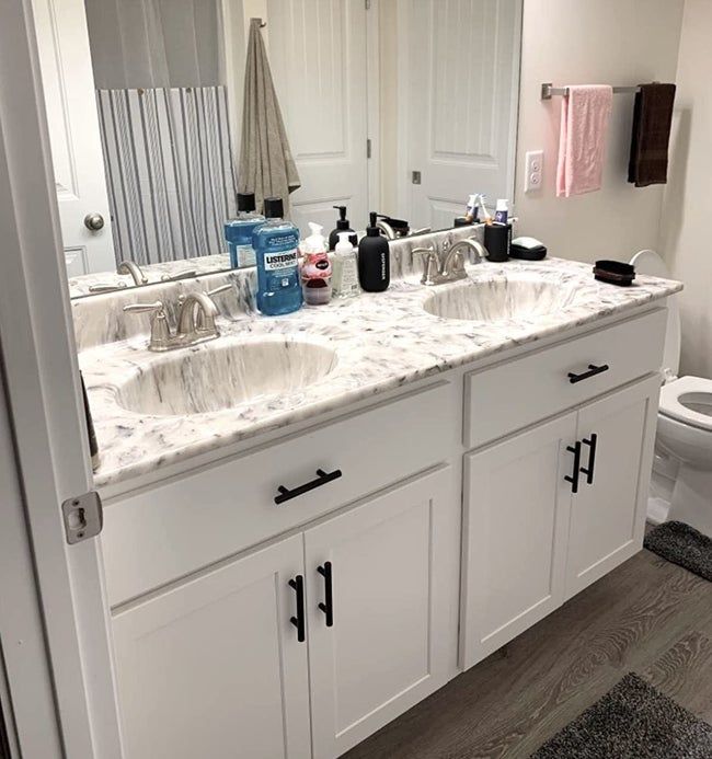 A reviewer's bathroom showcasing the black cabinet pulls.