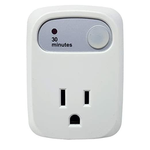 The white three-pronged outlet with a label reading