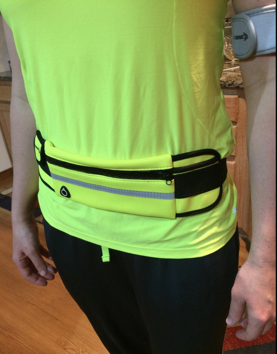 A reviewer wearing a neon yellow belt.