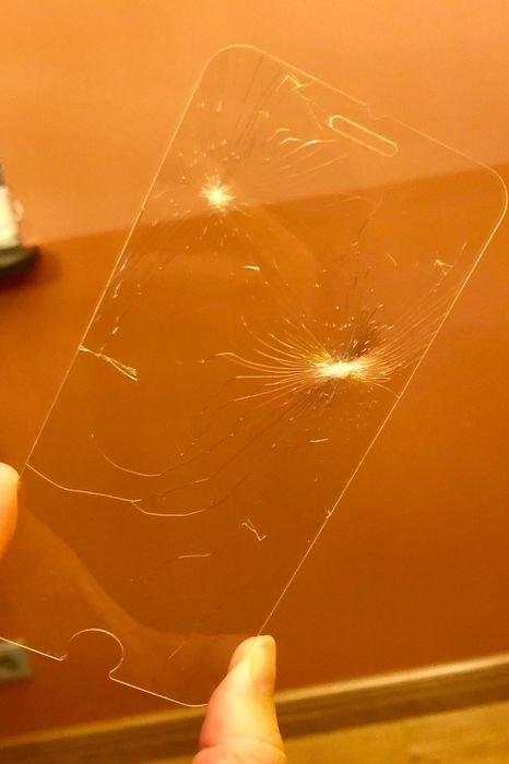 A review photo showing a shattered screen protector.