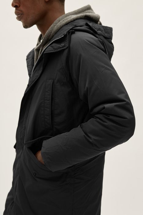 Model wearing the ReNew parka in black