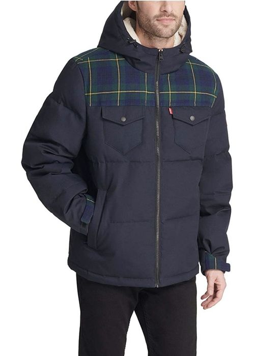 A model is seen wearing a navy parka.