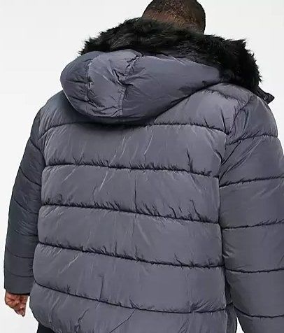 Back view of the same model wearing the grey jacket
