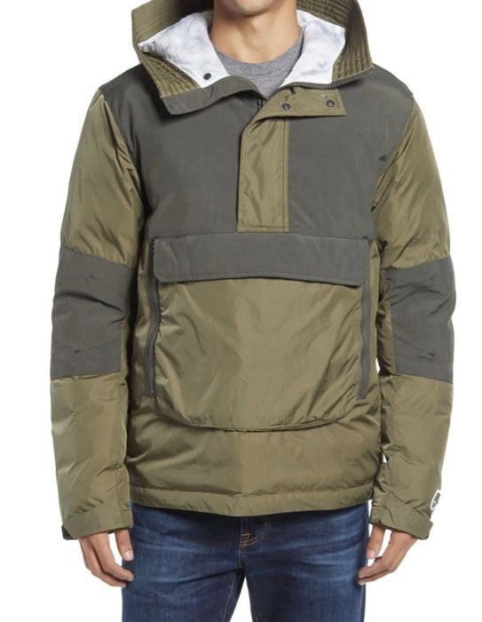 Front view of a model wearing a green anorak