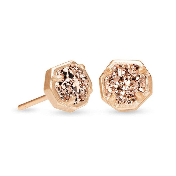 A detailed close-up of stunning rose gold gemstone earrings, capturing their brilliant sparkle and intricate design.