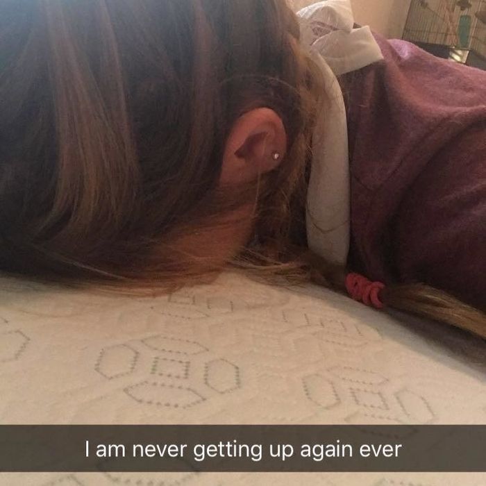 reviewer's photo with their face on a mattress, captioned