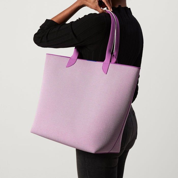 a model showcasing the purple oversized tote bag