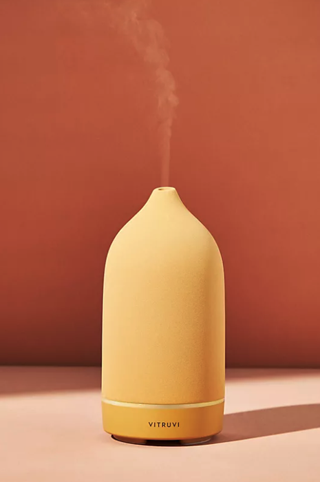 A matte yellow stone diffuser that seamlessly blends functionality with stylish home decor.