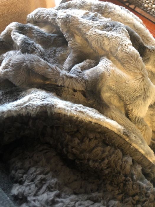 A reviewer's image showcasing a gray blanket.