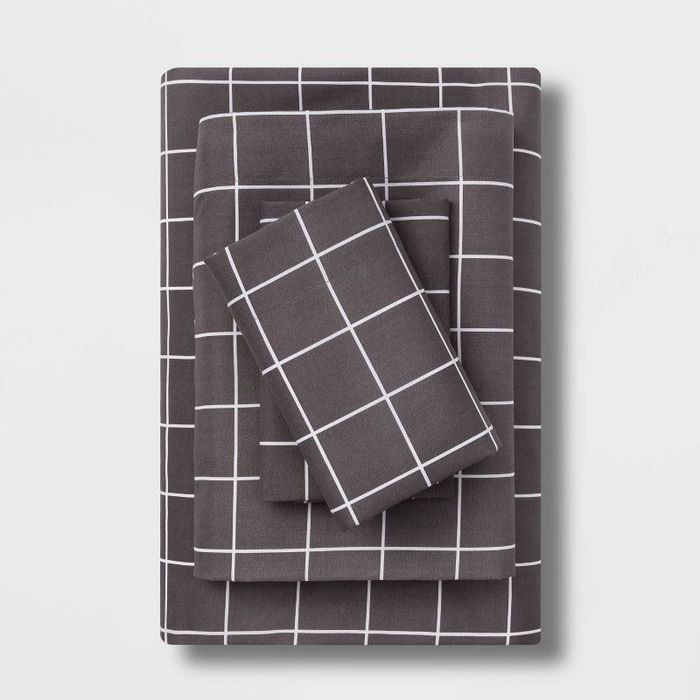 neatly folded sheets in a classic gray and white checkered pattern