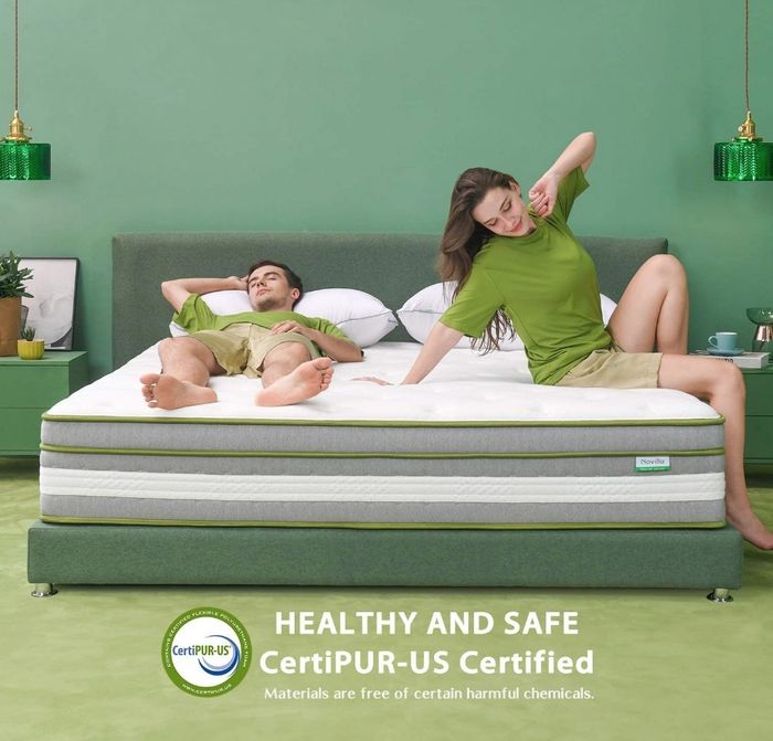 Models relaxing on a hybrid mattress equipped with edge support and infused with cooling gel for added comfort.