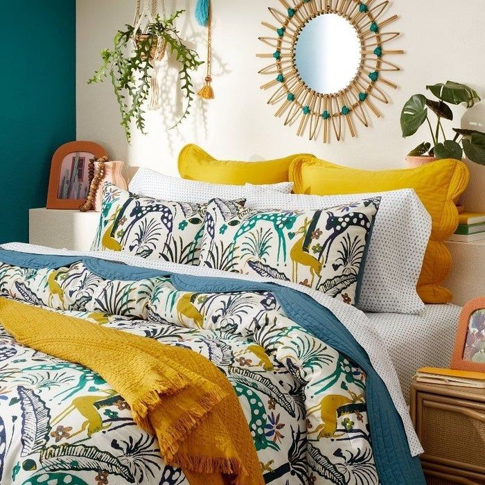the patterned bedding displayed on a beautifully styled bed