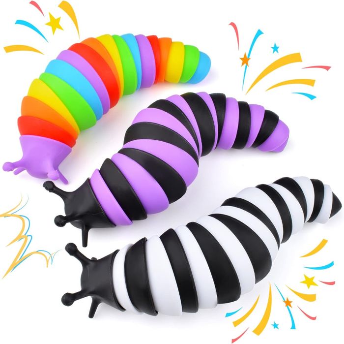 A slug in rainbow colors, one in black and purple, and another in black and white.