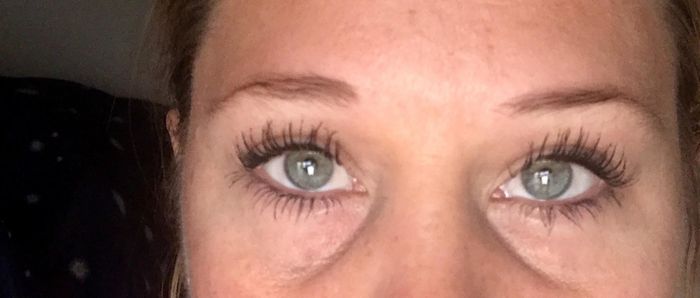 The same reviewer now with mascara, showcasing longer, darker, and more defined lashes