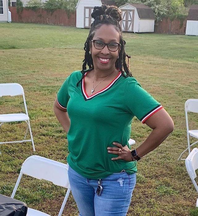 Reviewer sporting the dark green top