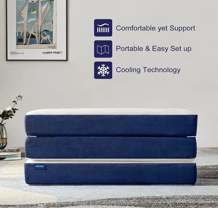 A foldable mattress featuring cooling gel and a removable, washable topper for added comfort and convenience