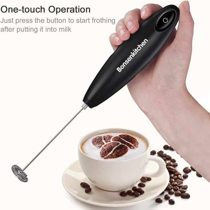 A sleek black handheld frother featuring a button to start the frothing process, perfect for creating a frothy coffee experience.