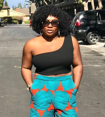 Reviewer wearing a sleek black tank top.