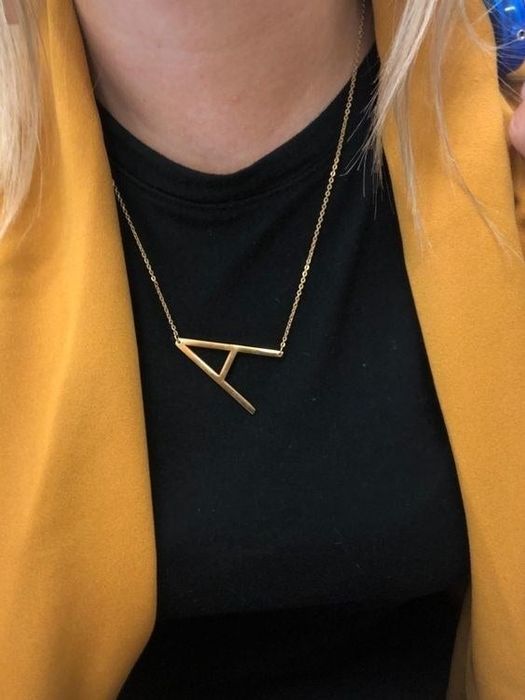 A reviewer showcasing the necklace